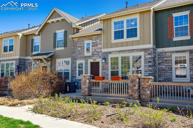 multi unit property with board and batten siding and stone siding