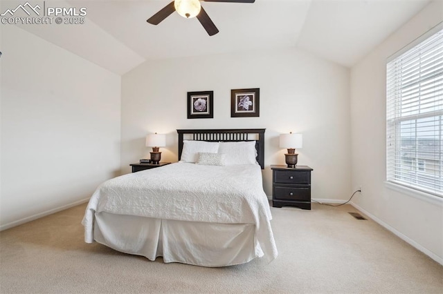 bedroom featuring carpet, vaulted ceiling, baseboards, and ceiling fan