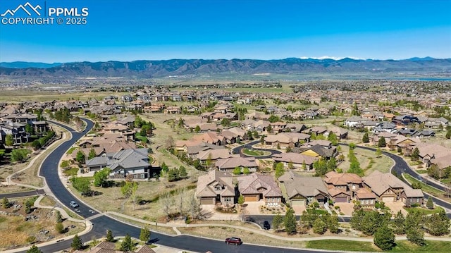 aerial perspective of suburban area with a mountainous background