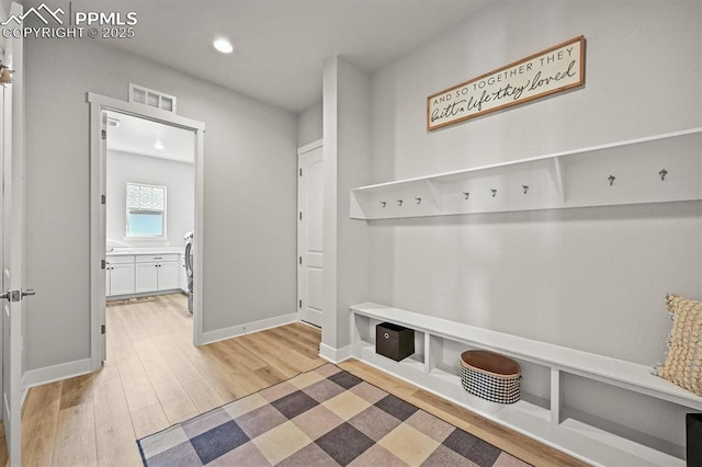 3293 Offbeaten Pl, Castle Rock, CO 80108 - mudroom featuring light wood-type flooring, recessed lighting, and baseboards