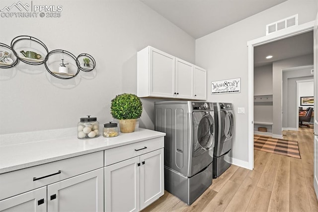 3293 Offbeaten Pl, Castle Rock, CO 80108 - washroom featuring washer and clothes dryer, light wood-style floors, cabinet space, baseboards, and recessed lighting