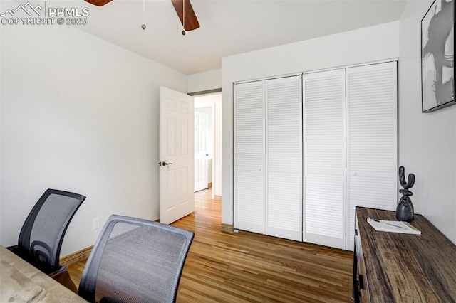 home office with wood finished floors and ceiling fan