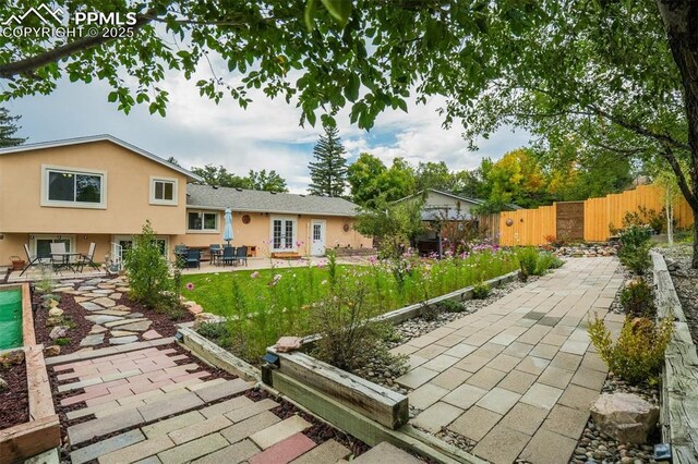 view of patio / terrace featuring fence