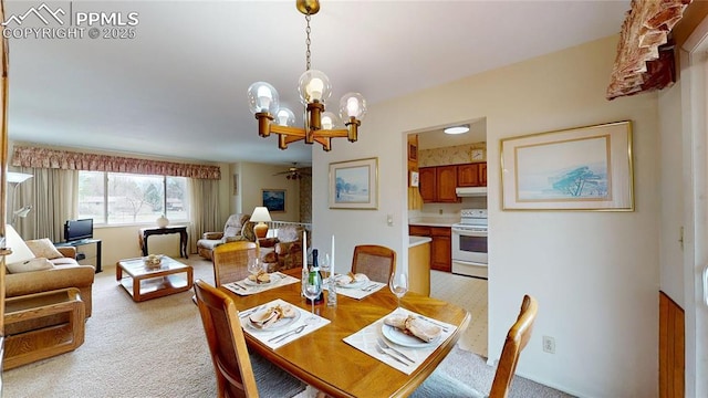 4012 Maxwell Pl, Colorado Springs, CO 80909 - dining area with a chandelier, a ceiling fan, and light carpet