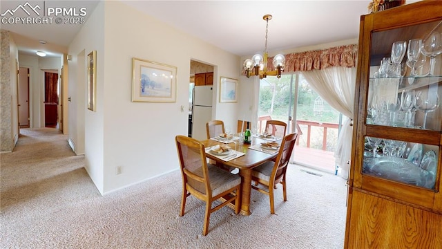 4012 Maxwell Pl, Colorado Springs, CO 80909 - dining room featuring light carpet and a chandelier