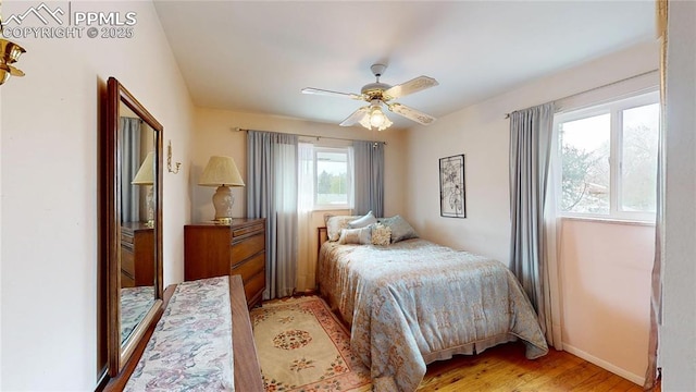 4012 Maxwell Pl, Colorado Springs, CO 80909 - bedroom with light wood-style floors, baseboards, and a ceiling fan