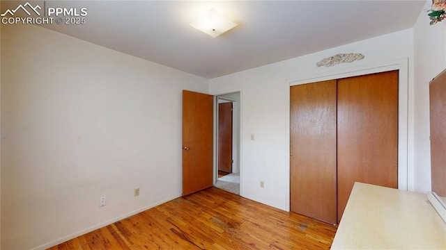 4012 Maxwell Pl, Colorado Springs, CO 80909 - unfurnished bedroom with light wood finished floors, a closet, and baseboards