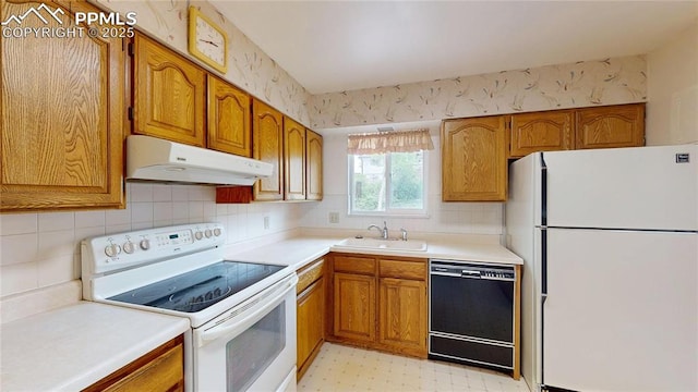 4012 Maxwell Pl, Colorado Springs, CO 80909 - kitchen featuring white appliances, under cabinet range hood, a sink, and brown cabinets