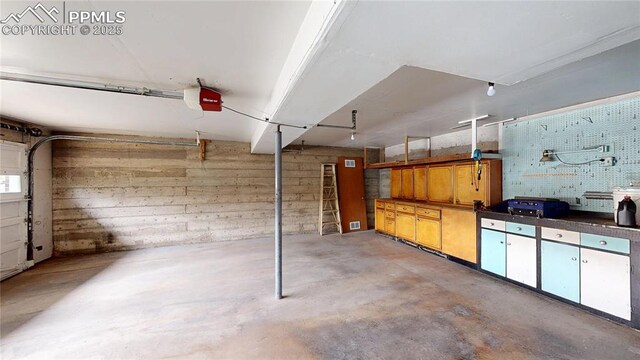 4012 Maxwell Pl, Colorado Springs, CO 80909 - garage featuring a garage door opener