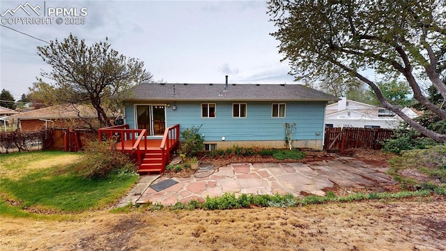 4012 Maxwell Pl, Colorado Springs, CO 80909 - rear view of property featuring a deck and a patio area