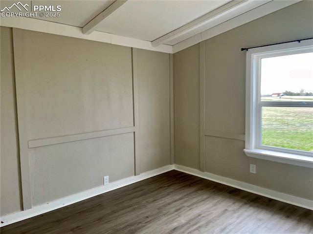 17940 Countdown Dr, Peyton, CO 80831 - unfurnished room featuring dark wood finished floors, attic access, and baseboards