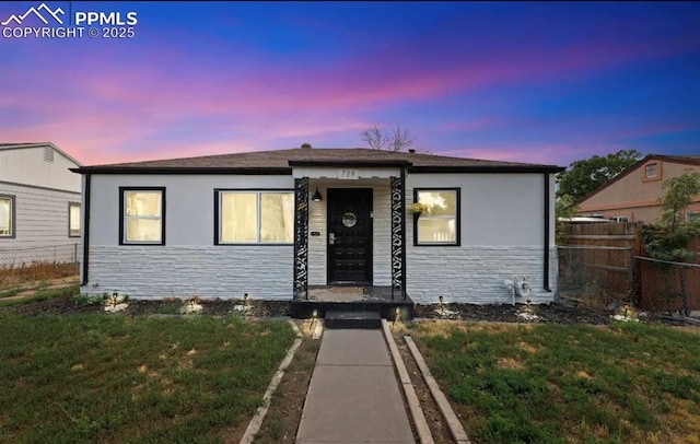 739 S Utica St, Denver, CO 80219 - bungalow-style home with stone siding and stucco siding