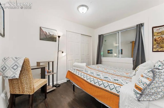 739 S Utica St, Denver, CO 80219 - bedroom featuring dark wood-style flooring and a closet