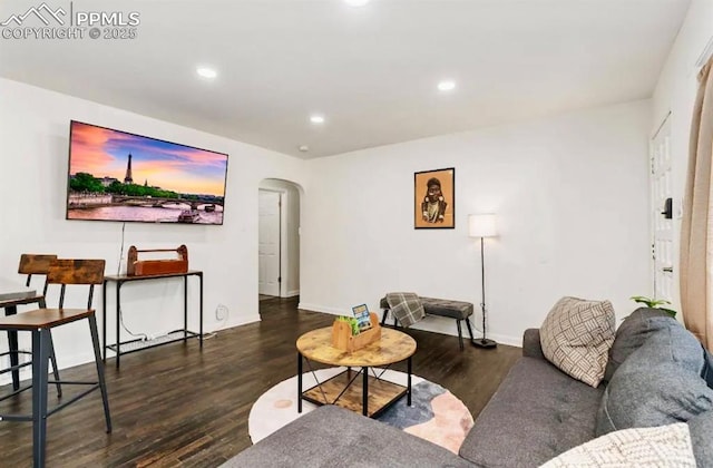 739 S Utica St, Denver, CO 80219 - living area with arched walkways, wood finished floors, recessed lighting, and baseboards