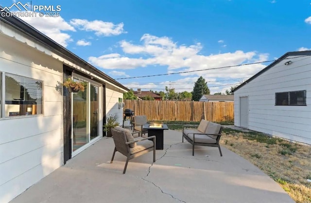 739 S Utica St, Denver, CO 80219 - view of patio featuring a fire pit and fence