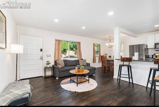 739 S Utica St, Denver, CO 80219 - living room featuring a chandelier, dark wood finished floors, and recessed lighting