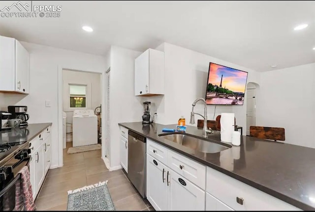 739 S Utica St, Denver, CO 80219 - kitchen featuring dishwasher, a sink, dark countertops, washing machine and clothes dryer, and light tile patterned flooring