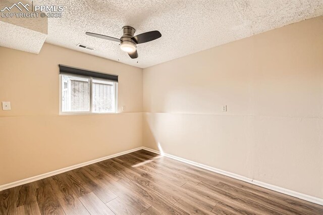 4790 Hennings Dr, Colorado Springs, CO 80911 - empty room featuring a ceiling fan, a textured ceiling, wood finished floors, and baseboards