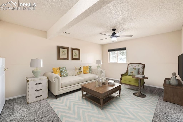 4790 Hennings Dr, Colorado Springs, CO 80911 - living room featuring a textured ceiling, ceiling fan, beamed ceiling, baseboards, and light carpet