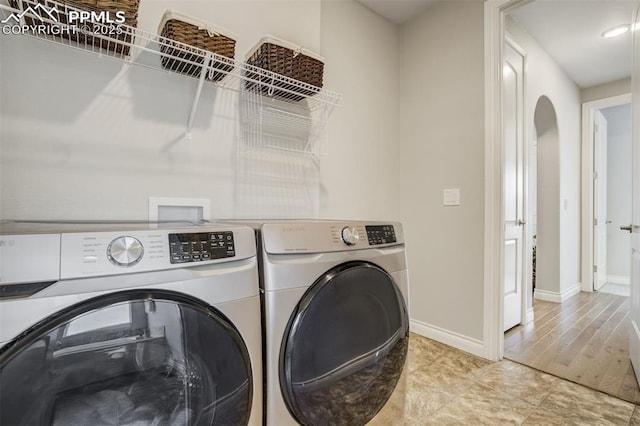 6898 Sedgerock Ln, Colorado Springs, CO 80927 - laundry area with separate washer and dryer and baseboards