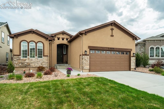 6898 Sedgerock Ln, Colorado Springs, CO 80927 - mediterranean / spanish home featuring stone siding, stucco siding, concrete driveway, and a front lawn