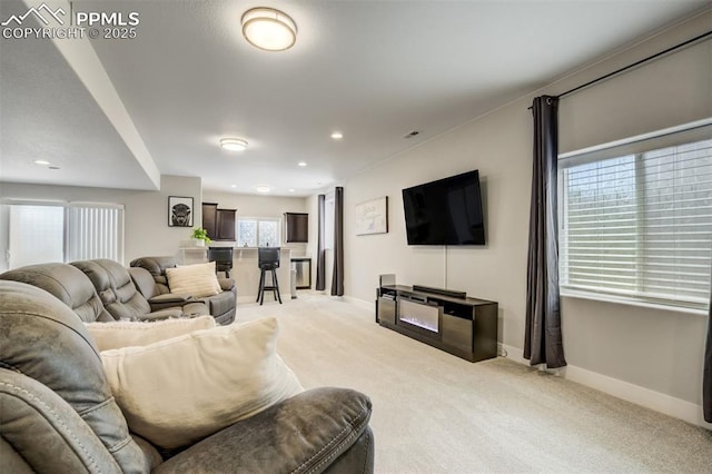 6898 Sedgerock Ln, Colorado Springs, CO 80927 - living area featuring light colored carpet, baseboards, and recessed lighting