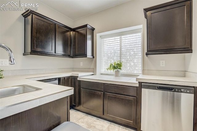 6898 Sedgerock Ln, Colorado Springs, CO 80927 - kitchen featuring dishwasher, dark brown cabinetry, and a sink