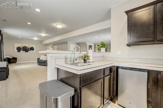 6898 Sedgerock Ln, Colorado Springs, CO 80927 - kitchen with a sink, refrigerator, dark brown cabinetry, open floor plan, and recessed lighting