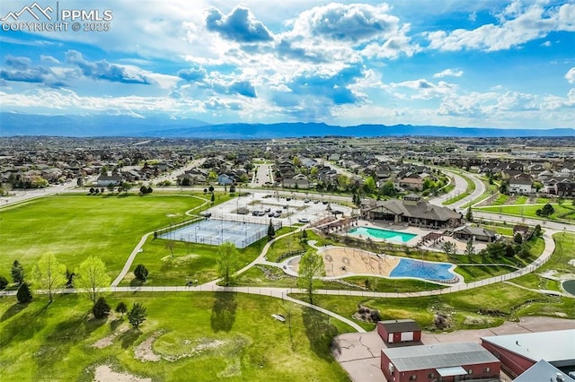 6898 Sedgerock Ln, Colorado Springs, CO 80927 - aerial view of residential area with a mountainous background and a pool area