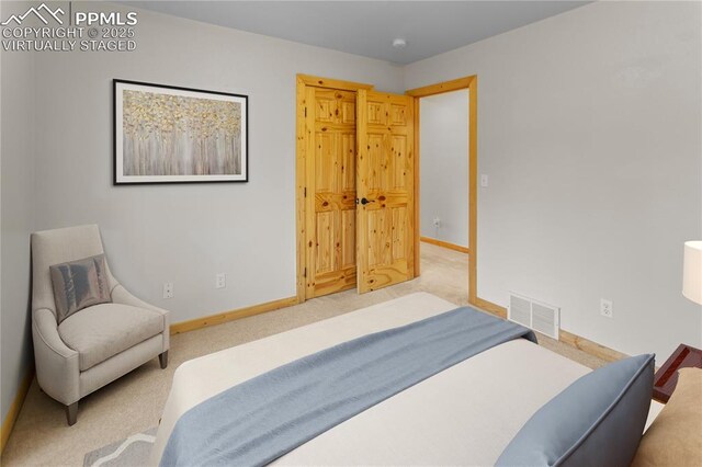 bedroom with baseboards and carpet
