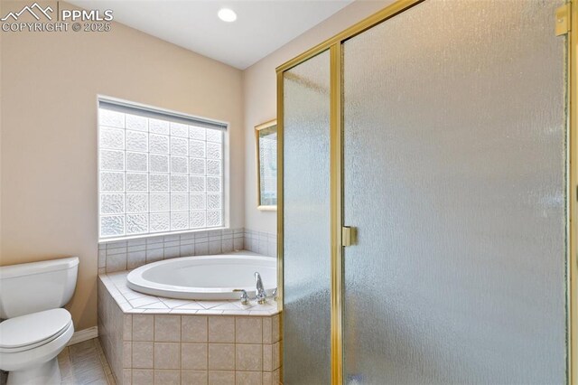 full bathroom with a garden tub, toilet, a stall shower, tile patterned flooring, and baseboards