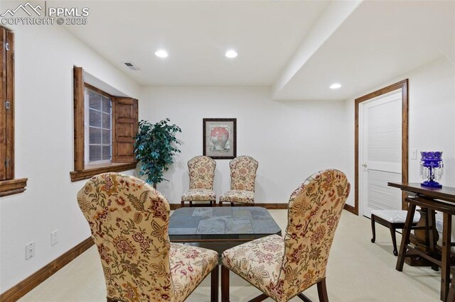 dining area featuring recessed lighting, light colored carpet, and baseboards