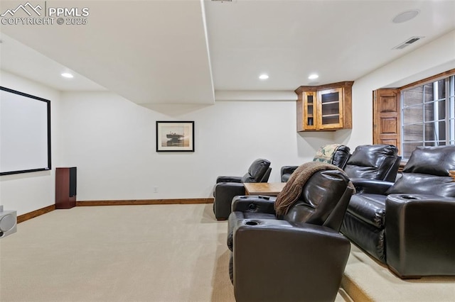 home theater featuring light carpet, baseboards, and recessed lighting