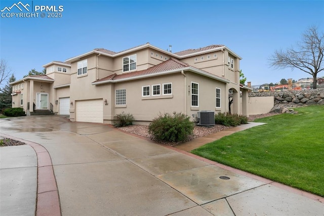 view of property exterior featuring cooling unit, a garage, driveway, a lawn, and stucco siding