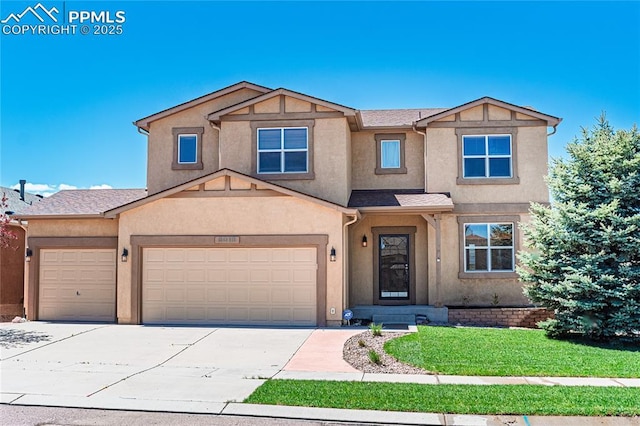6018 Cumbre Vista Way, Colorado Springs, CO 80924 - view of front facade with stucco siding, driveway, a garage, and a front lawn