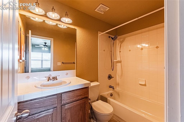 6018 Cumbre Vista Way, Colorado Springs, CO 80924 - full bath featuring toilet, vanity, washtub / shower combination, a textured wall, and ceiling fan