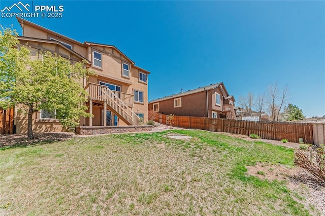 6018 Cumbre Vista Way, Colorado Springs, CO 80924 - rear view of property featuring stairway, stucco siding, and a wooden deck