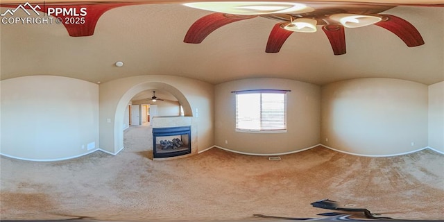 6018 Cumbre Vista Way, Colorado Springs, CO 80924 - spare room featuring ceiling fan, carpet floors, baseboards, and a tiled fireplace