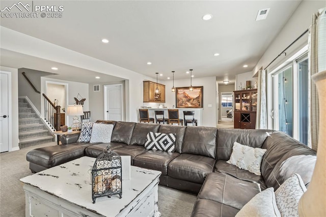 16231 Thunder Cat Way, Monument, CO 80132 - living room with stairs, recessed lighting, and light colored carpet