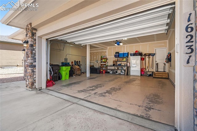 16231 Thunder Cat Way, Monument, CO 80132 - garage featuring a garage door opener and driveway