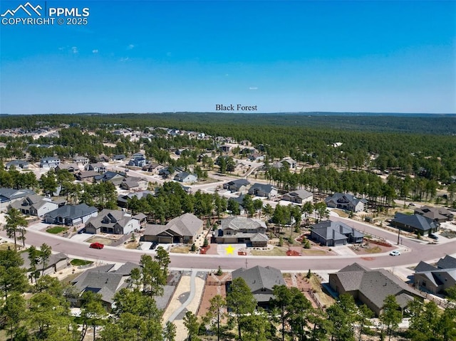 16231 Thunder Cat Way, Monument, CO 80132 - aerial view of residential area featuring a heavily wooded area
