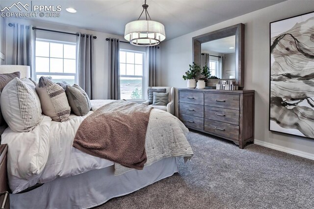 carpeted bedroom featuring a chandelier, baseboards, and recessed lighting