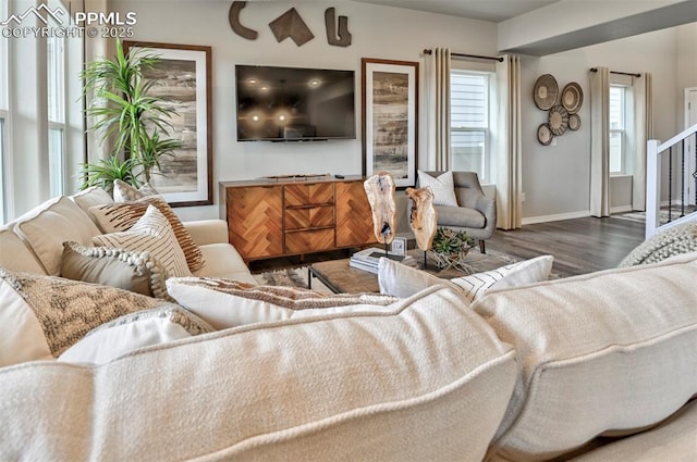 living room with wood finished floors and baseboards