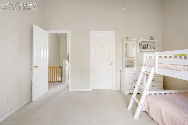 bedroom with carpet and baseboards