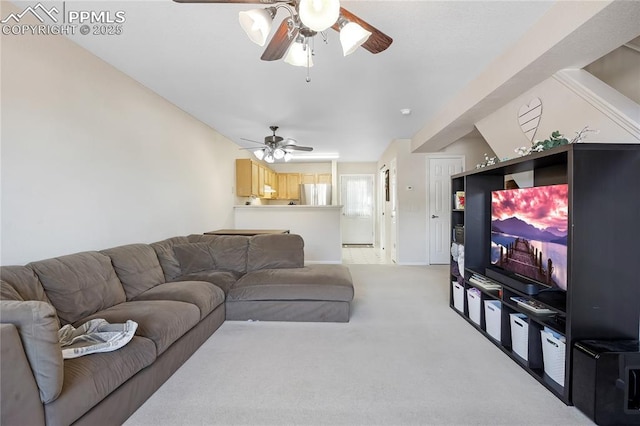 living room with a ceiling fan, light carpet, and baseboards