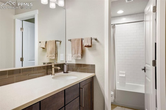 16420 Mountain Glory Dr, Monument, CO 80132 - bathroom with toilet, vanity, and shower / tub combo with curtain
