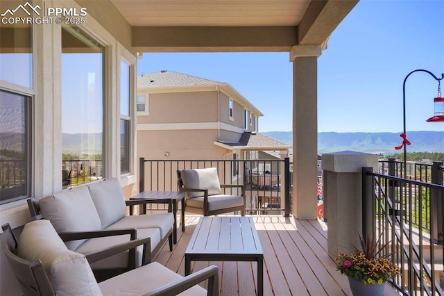 16420 Mountain Glory Dr, Monument, CO 80132 - wooden terrace with a mountain view and an outdoor living space
