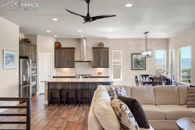 16420 Mountain Glory Dr, Monument, CO 80132 - living room featuring dark wood finished floors, ceiling fan, and recessed lighting