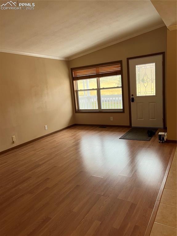 321 Aspen St, Cripple Creek, CO 80813 - foyer featuring plenty of natural light, crown molding, wood finished floors, and baseboards
