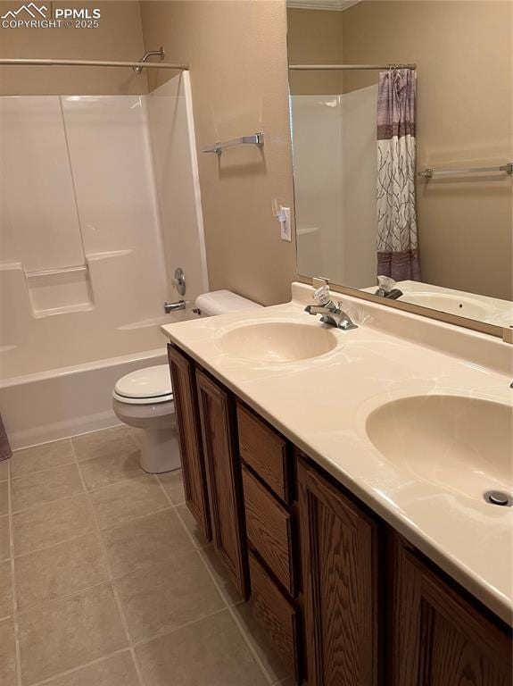 bathroom featuring toilet, shower / tub combo with curtain, and double vanity
